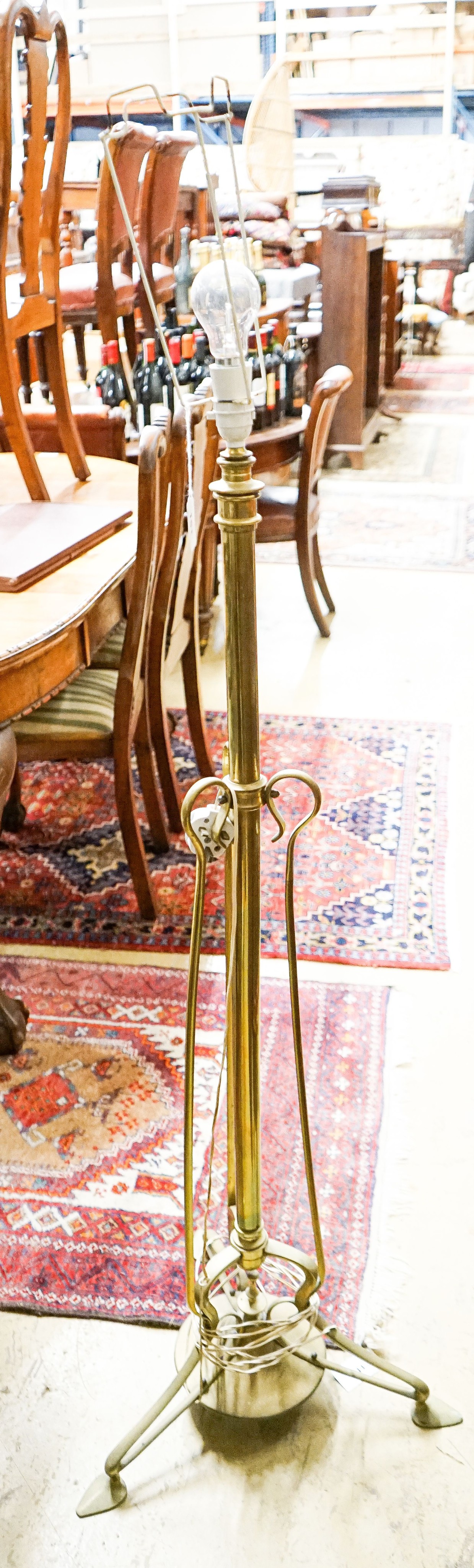 An Art Nouveau brass telescopic standard lamp